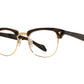 Front angle view of chocolate and gold American Optical Sirmont frame only acetate and metal sunglasses